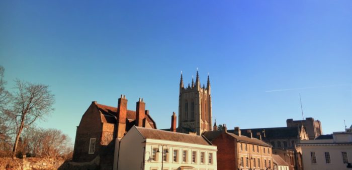 RP The cathedral tower and other buildings under a blue sky in Bury St Edmunds Suffolk shutterstock_1319058728 | Garrington East Living in Suffolk